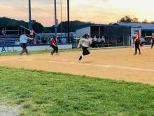 Ellie Embry, of the Crimson Tide, puts the ball in play.