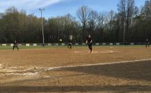 Avery Gleason of the Cardinals delivers the pitch.