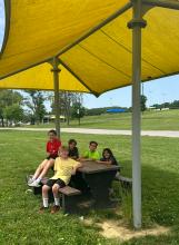  MES 3rd graders enjoying the picnic tables at Morgantown City Park made from recycled tire waste. Photo credit: Zac Johnson