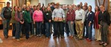 Commissioner of Agriculture Jonathan Shell, center, was surrounded by Kentucky beef industry personnel and producers as he celebrated May as Beef Month in Kentucky at The Yards in Lexington. The Yards, in the Blue Grass Regional Stockyards Marketplace, is an education center focusing on science and practices of the beef industry. (Kentucky Department of Agriculture)