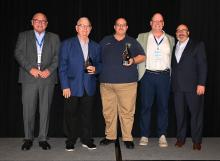Morgantown Mayor Billy Phelps accepts the 2024 KLC LEAD Award along with Cave City Mayor Dwayne Hatcher. Left to right: KLC Immediate Past President Auburn Mayor Mike Hughes, Mayor Hatcher, Mayor Phelps, family representative Jerry Deatherage, KLC Executive Director/CEO J.D. Chaney.     