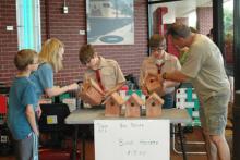 Mike, Melissa, and Thomas pick out their birdhouse.