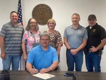 Attending the signing at the courthouse were: Left to right, PVA Kenny Swift; Butler County DAR member Deborah Taylor Givens; County Clerk Sherry Embry Johnson; Judge Flener; Morgantown VFD Chief Brian Hope; and Deputy Sheriff Joe Alford.