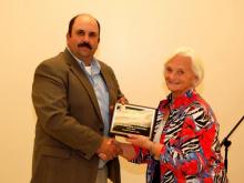  Betty Farris of Reedyville Rural Development accepts the 2012 "Mike Duff Outstanding Club Award" at last year's Rural Development Annual Meeting.