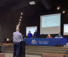 Asst. Supt. Josh Belcher swears in new board members.