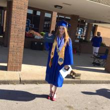Valedictorian Emily Tyree with her diploma. Tyree gave the traditional speech at Saturday's event. 