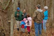 Greg Drake prepares to tap a tree for a maple syrup production class in 2012