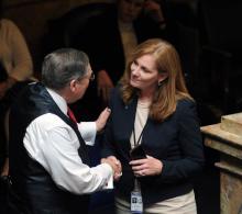Sen. C.B. Embry, R-Morgantown, (left) congratulates Rep. Kimberly Poore Moser, R-Taylor Mill, upon the final passage of legislation she sponsored. (Photo: LRC-PI)