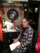 Joe in his room dedicated to Marine Corps memorabilia.