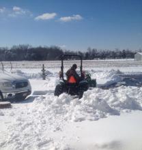 Pat Grubb cleaning his driveway before he heads out on the roads.  Big thank you to the County, City, and State Road Crews.