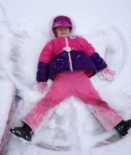 Jenna Brooks making snow angels.
