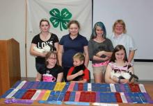 Sitting left to right:  Mary Hunter, Paul Brunk, and Pamela Moore. Standing: Amber Hudson, Olivia Dunn, Haley West, and 4-H Rabbit Leader - Angela Smith