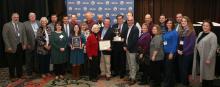 Leaders of Butler County Farm Bureau accept the "Top County" award from David S. Beck, KFB Executive Vice President, and John Sparrow, KFB Insurance Companies Chief Executive Officer.